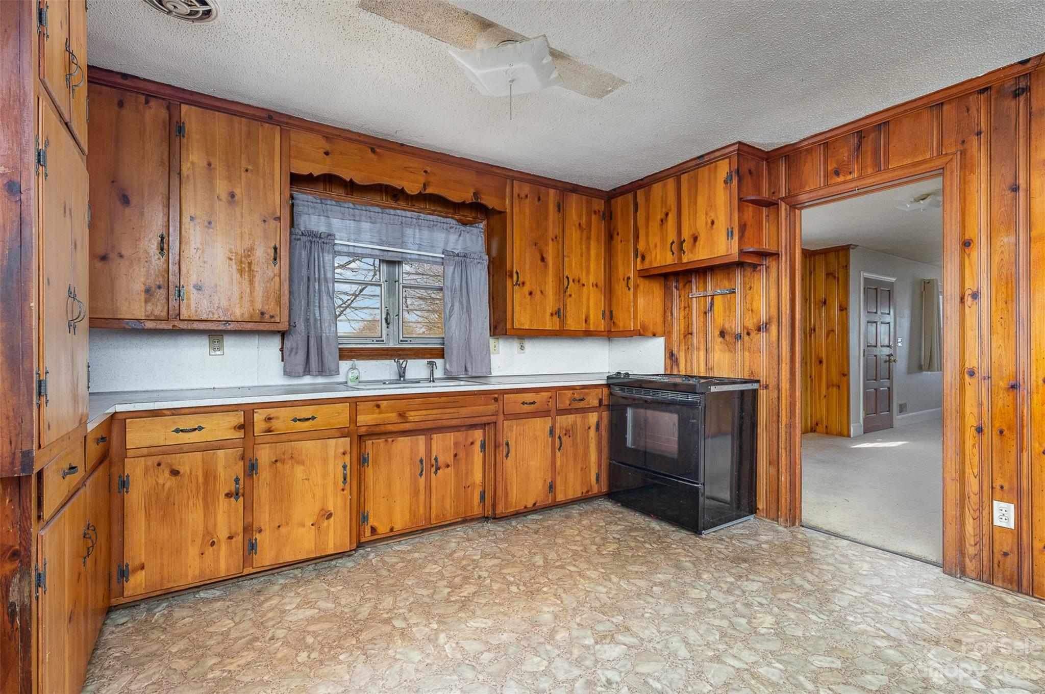 2765 Long Circle Iron Station, NC 28080 - Photo 6 of 26 a large kitchen with granite countertop a sink and a stove top oven