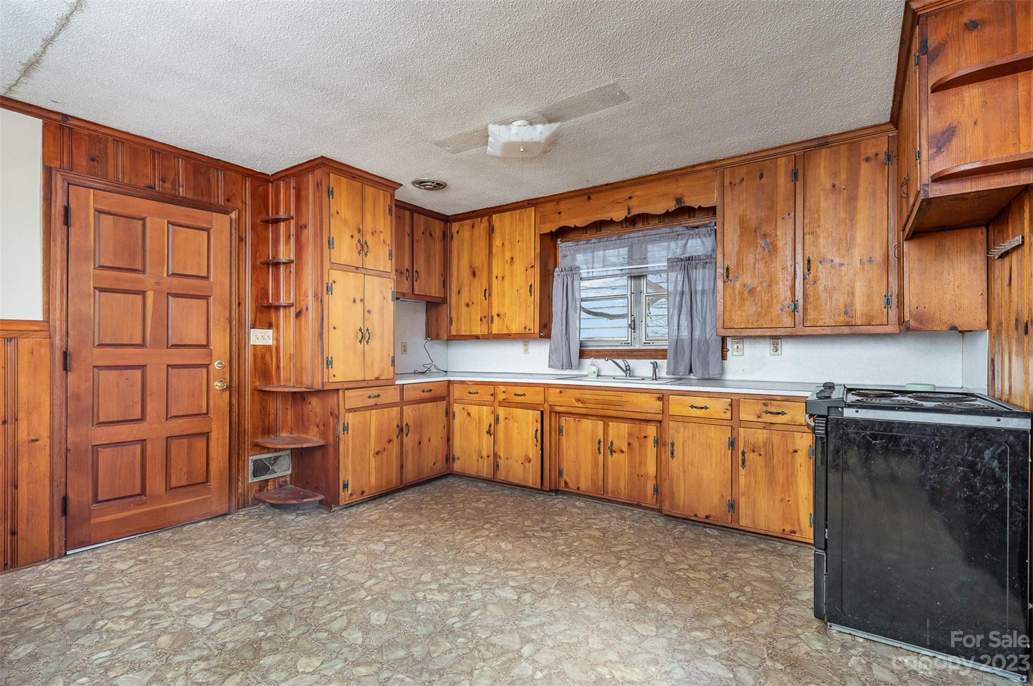 2765 Long Circle Iron Station, NC 28080 - Photo 7 of 26 a kitchen with stainless steel appliances granite countertop a stove a sink dishwasher and a refrigerator
