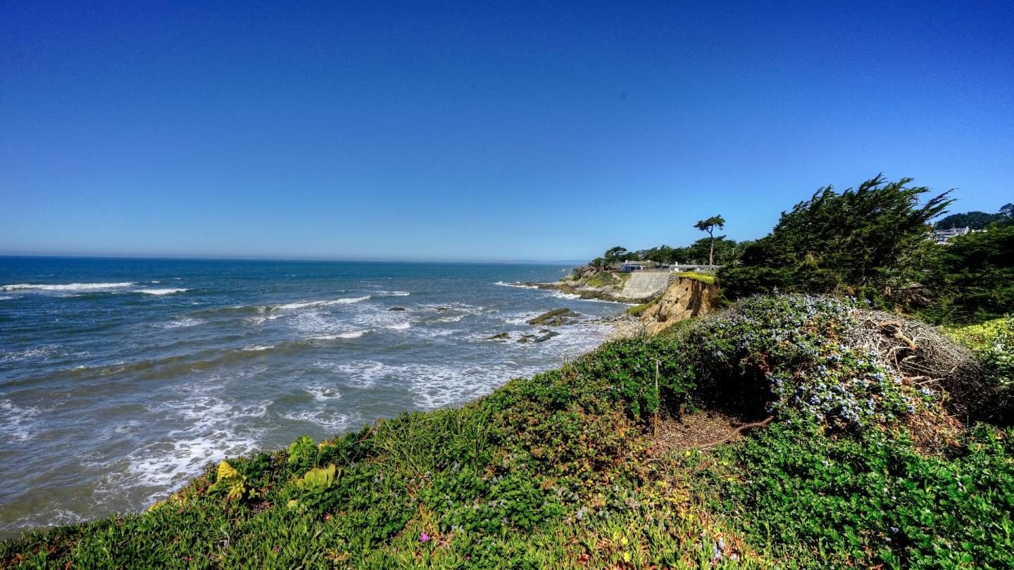 97 Beach Street Moss Beach, CA 94038 - Photo 11 of 43 a view of a lake with a yard