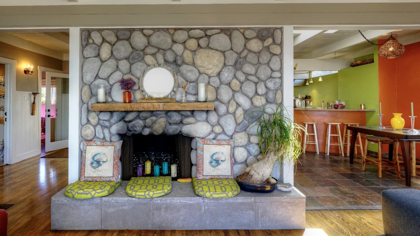 97 Beach Street Moss Beach, CA 94038 - Photo 23 of 43 a living room with fireplace and a wooden floor
