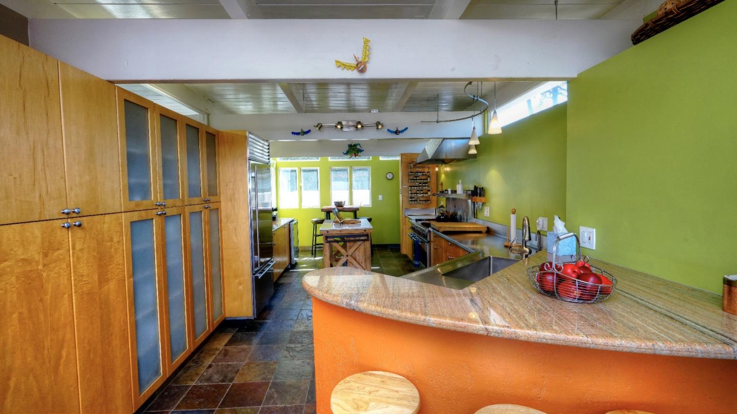 97 Beach Street Moss Beach, CA 94038 - Photo 27 of 43 a view of a entryway with furniture and a chandelier
