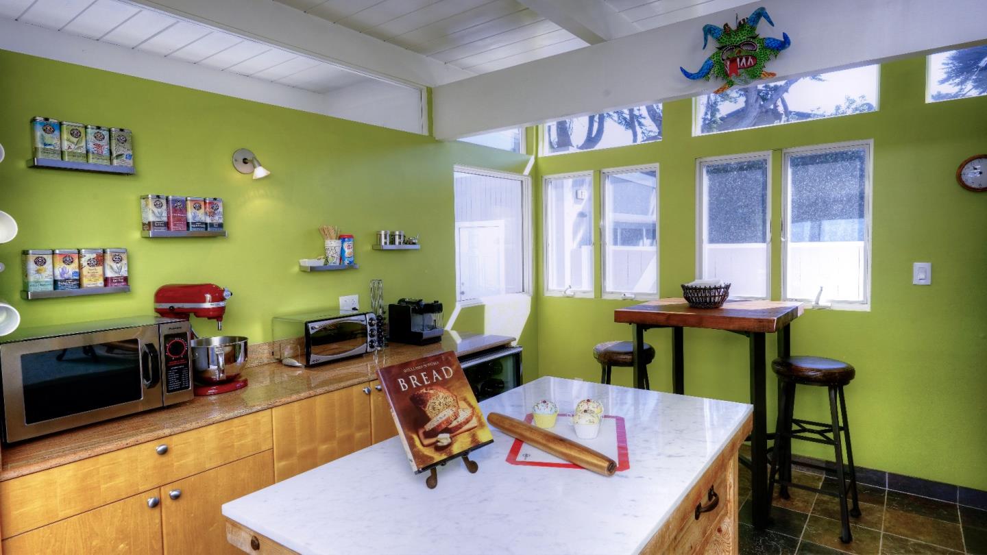 97 Beach Street Moss Beach, CA 94038 - Photo 31 of 43 a room with furniture and a window