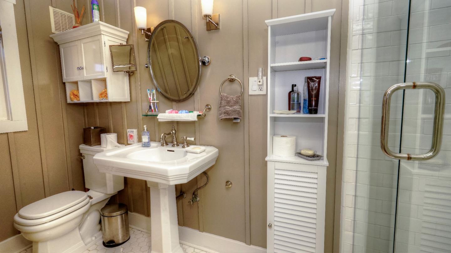 97 Beach Street Moss Beach, CA 94038 - Photo 36 of 43 a bathroom with a toilet sink and mirror