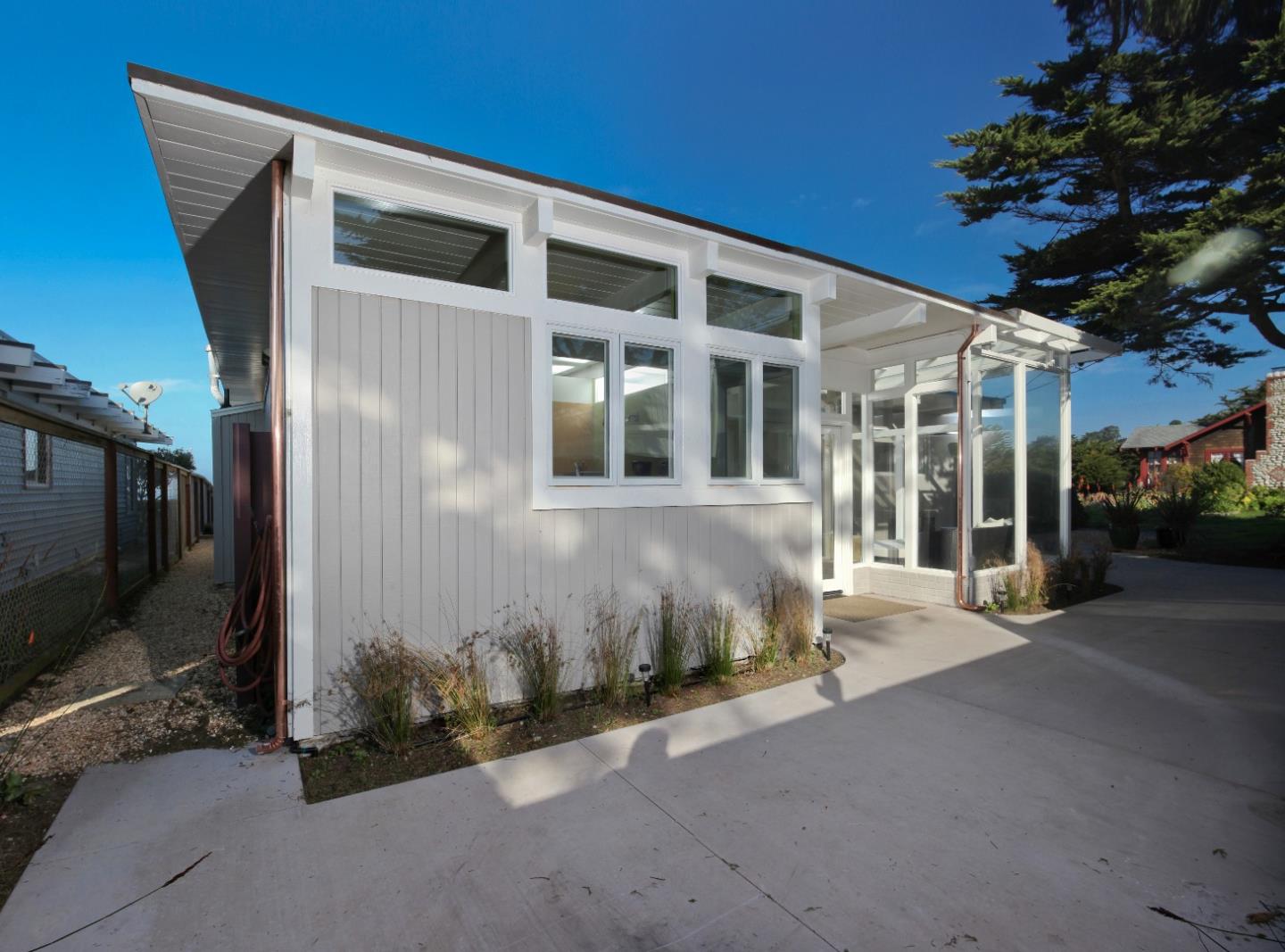 97 Beach Street Moss Beach, CA 94038 - Photo 5 of 43 a front view of a house with a yard