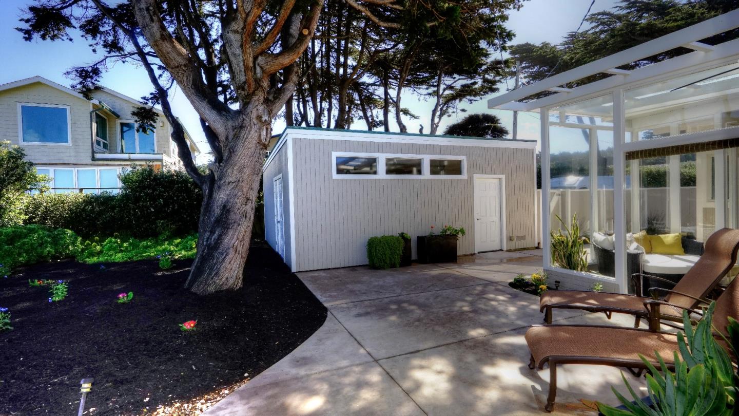 97 Beach Street Moss Beach, CA 94038 - Photo 10 of 43 a view of a house with backyard and sitting area