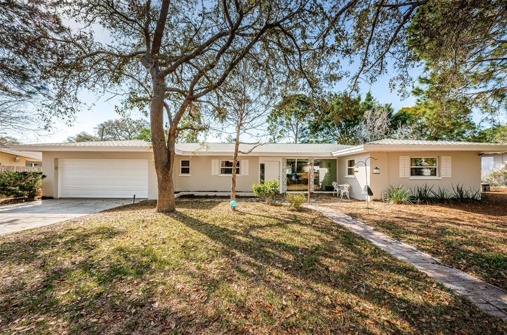 Mid-Century Modern design with lots of natural light in highly desired Fairway Estates.