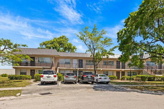 a kitchen with a stove top oven and cabinets