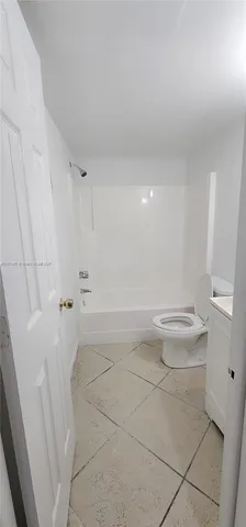 a bathroom with a bathtub and a sink
