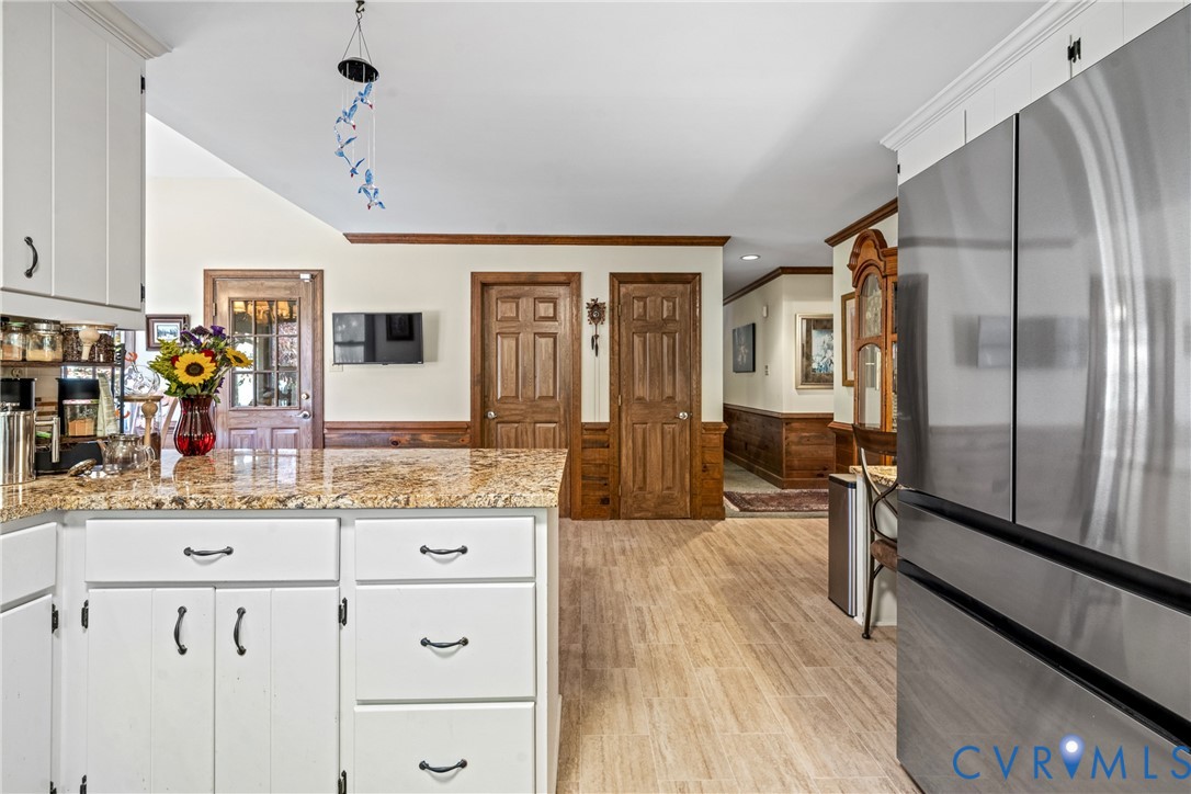 8404 Copperpenny Terrace Chesterfield, VA 23832 - Photo 11 of 40 a spacious bathroom with a granite countertop sink a mirror and a shower