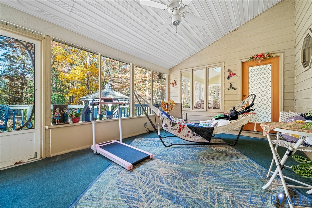 8404 Copperpenny Terrace Chesterfield, VA 23832 - Photo 14 of 40 a living room filled with furniture and floor to ceiling windows