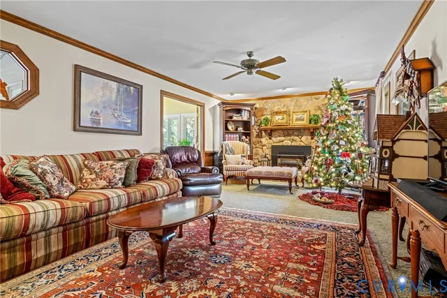 a living room with furniture or couch and a chandelier