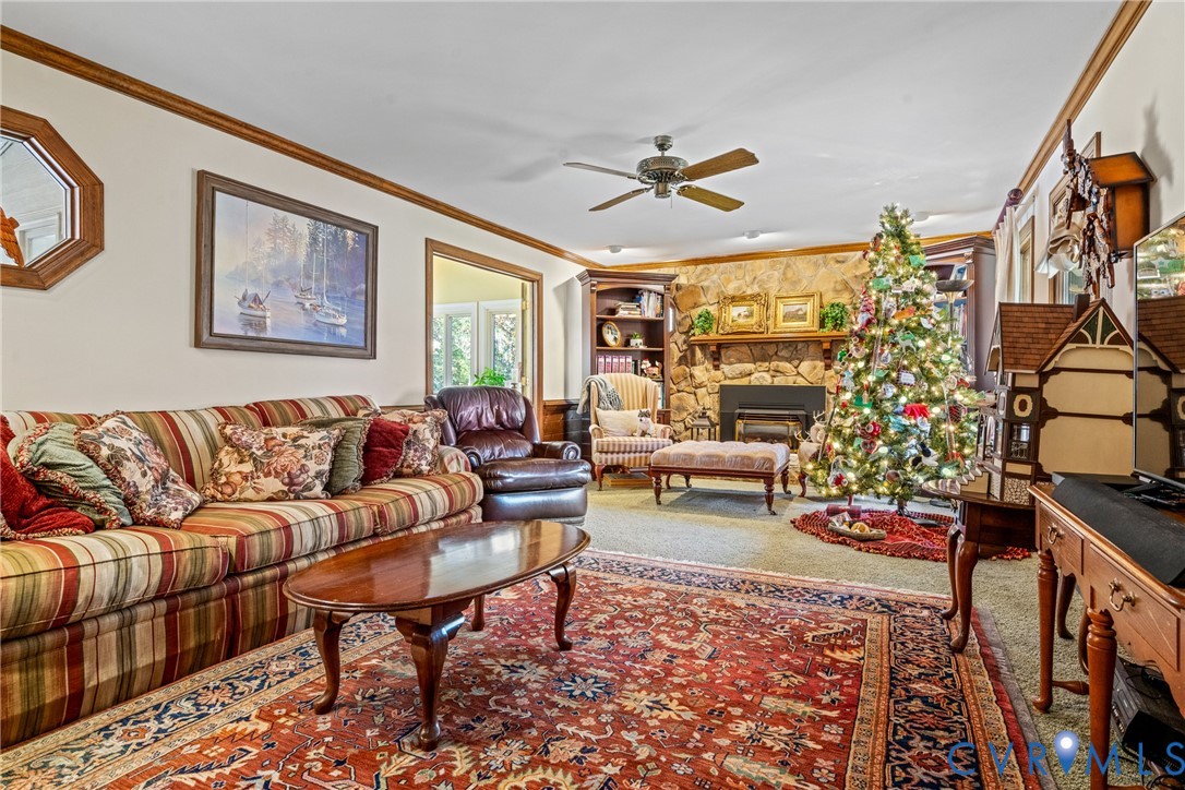 8404 Copperpenny Terrace Chesterfield, VA 23832 - Photo 15 of 40 a living room with furniture or couch and a chandelier
