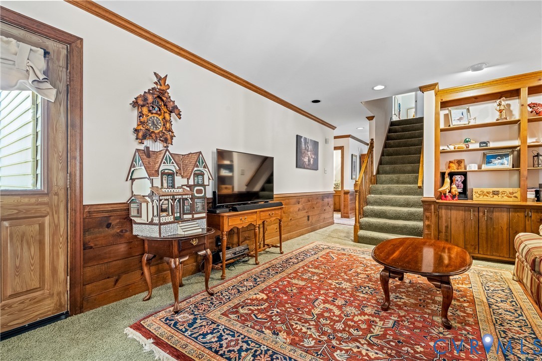 8404 Copperpenny Terrace Chesterfield, VA 23832 - Photo 16 of 40 a living room with furniture and a flat screen tv