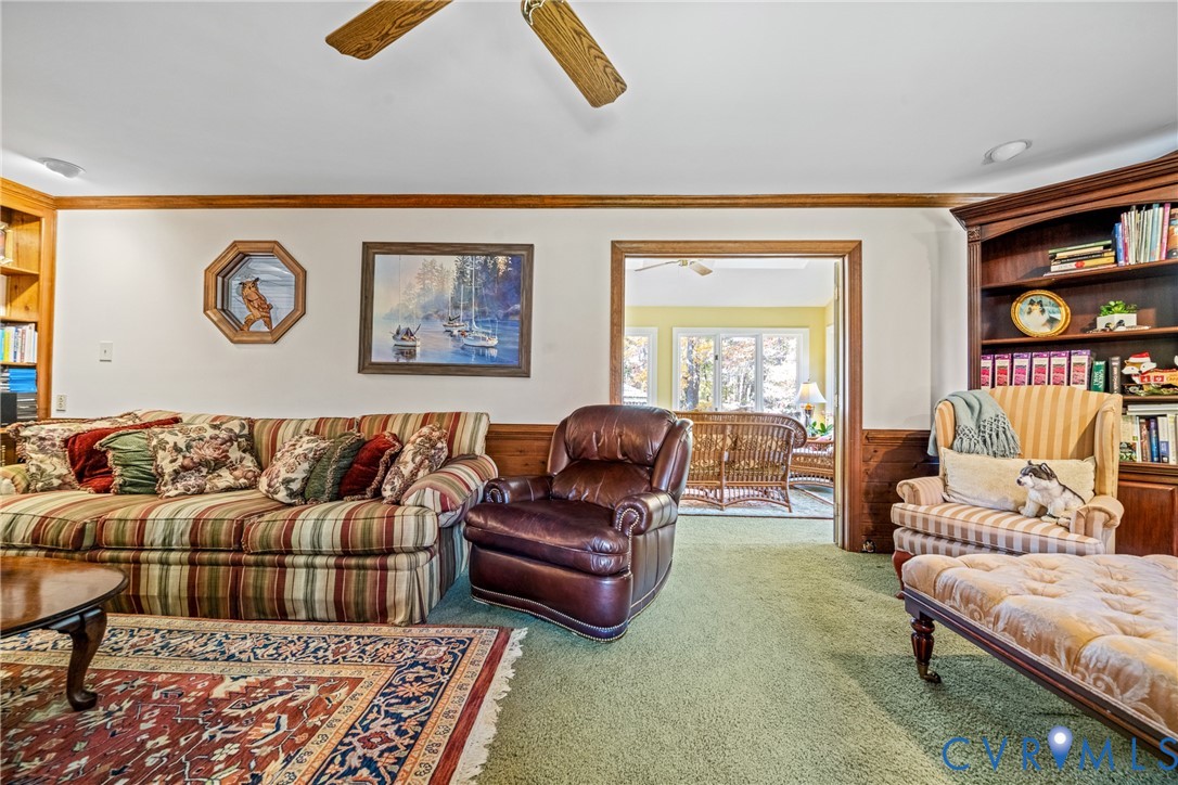 8404 Copperpenny Terrace Chesterfield, VA 23832 - Photo 17 of 40 a living room with furniture and a bookshelf