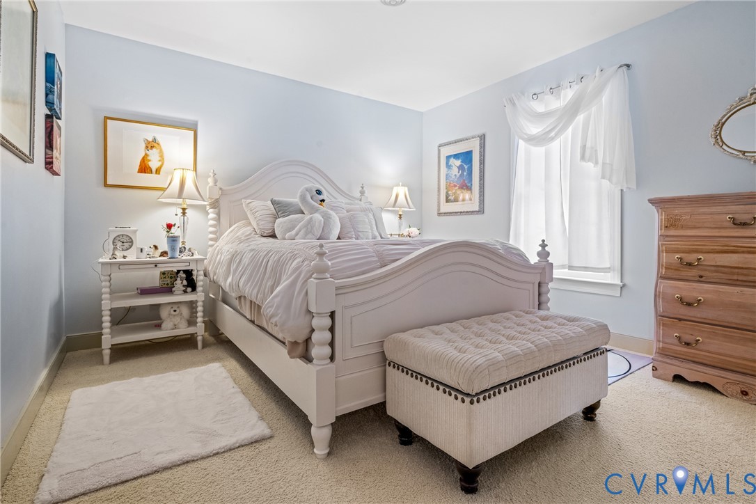 8404 Copperpenny Terrace Chesterfield, VA 23832 - Photo 20 of 40 a bedroom with a bed and a table