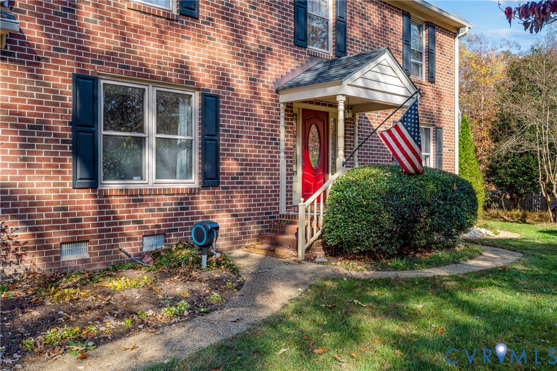 8404 Copperpenny Terrace Chesterfield, VA 23832 - Photo 2 of 40 a front view of a house with a yard