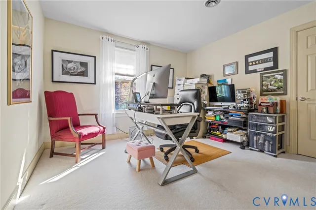 a work room with furniture and air hockey table