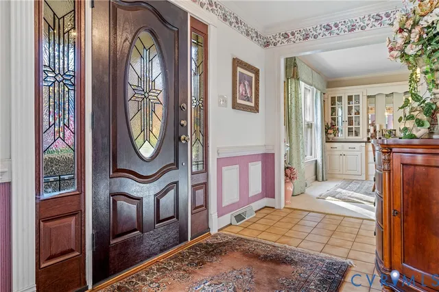 a bedroom with a bed and a mirror on the dresser