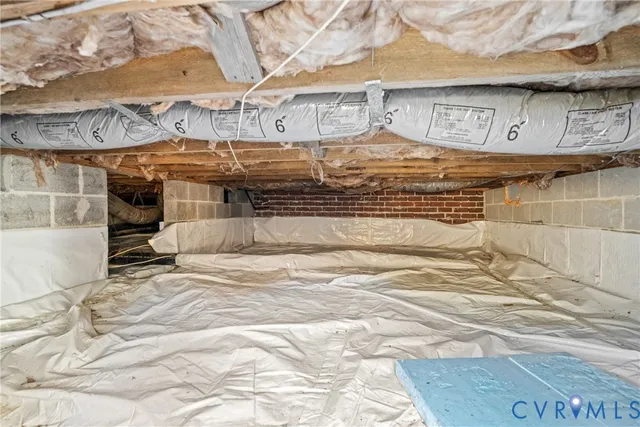 a view of backyard with wooden fence and trees