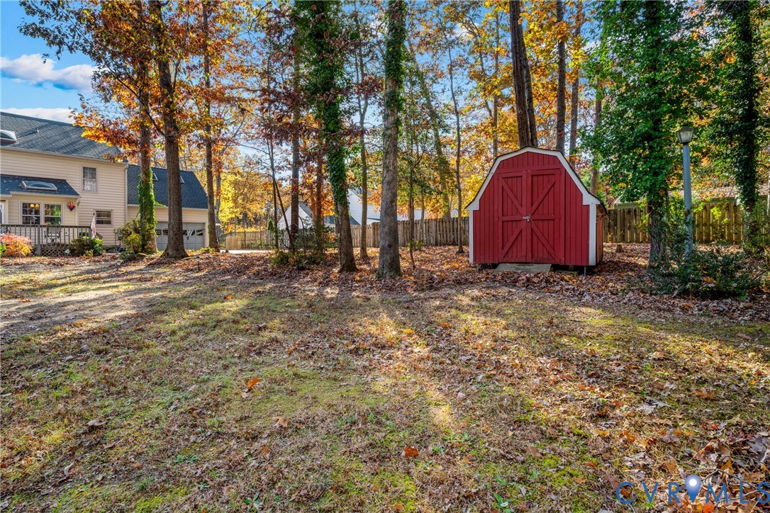 8404 Copperpenny Terrace Chesterfield, VA 23832 - Photo 35 of 40 a view of a yard with large trees and a barn