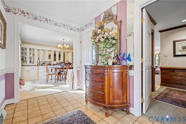 a view of a hallway with dining area