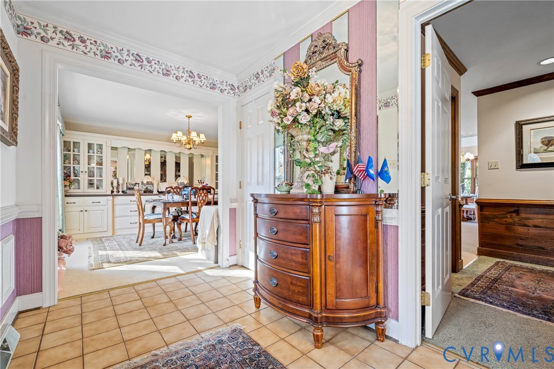 8404 Copperpenny Terrace Chesterfield, VA 23832 - Photo 4 of 40 a view of a hallway with dining area