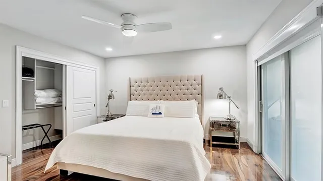 a living room with furniture and potted plants