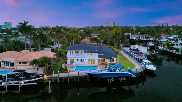 an aerial view of residential house with outdoor space and parking