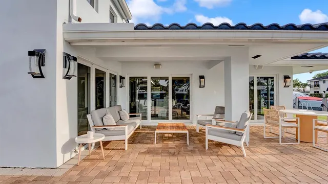 a view of swimming pool with a yard and sitting area