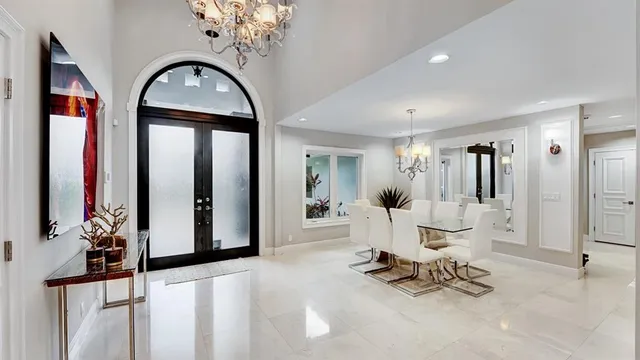 a view of a house with backyard porch and sitting area