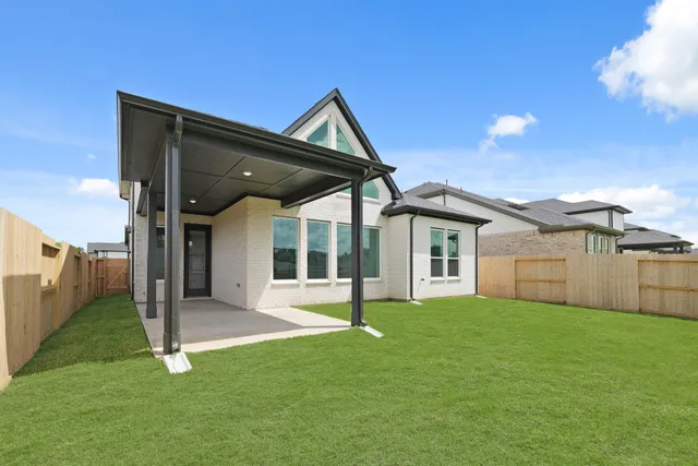 a front view of house with yard and porch