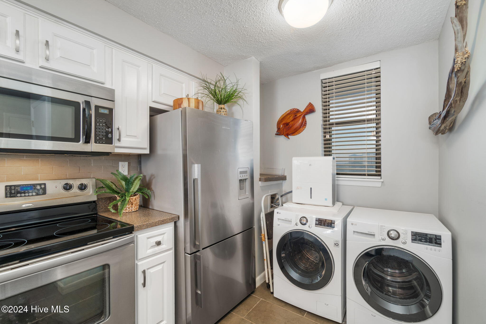 1505 Salter Path Road, Unit 203 A SUMMER WINDS Atlantic Beach, NC 28512 - Photo 24 of 42 Laundry area in kitchen
