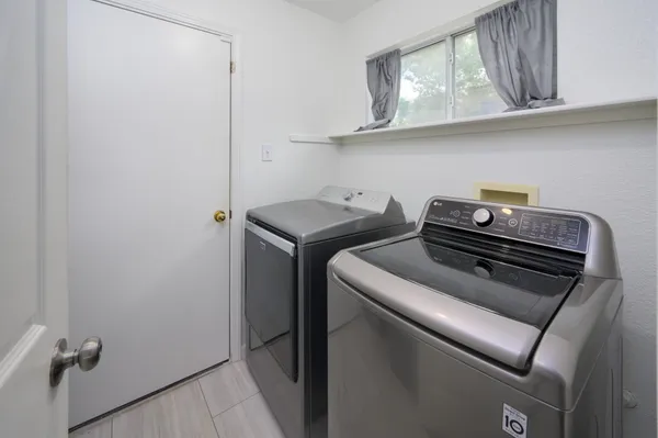 a utility room with dryer and washer