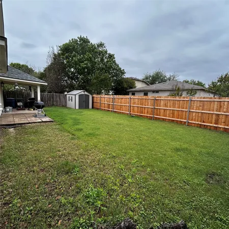 a view of a garden with houses