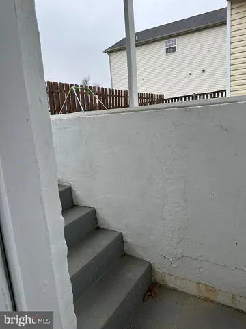 a view of a hallway with stairs