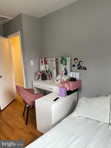 a bedroom with a bed and a table