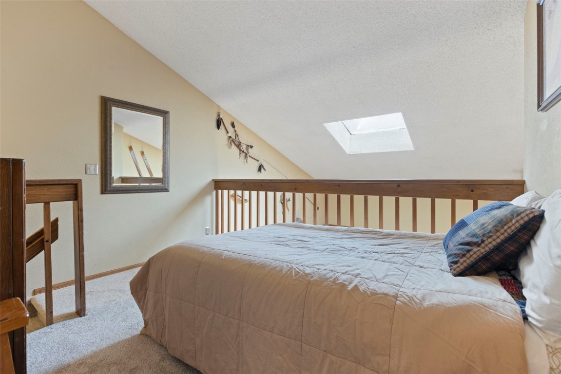 570 Bills Ranch Road, Unit 325 Frisco, CO 80443 - Photo 17 of 30 a bedroom with a bed and a window
