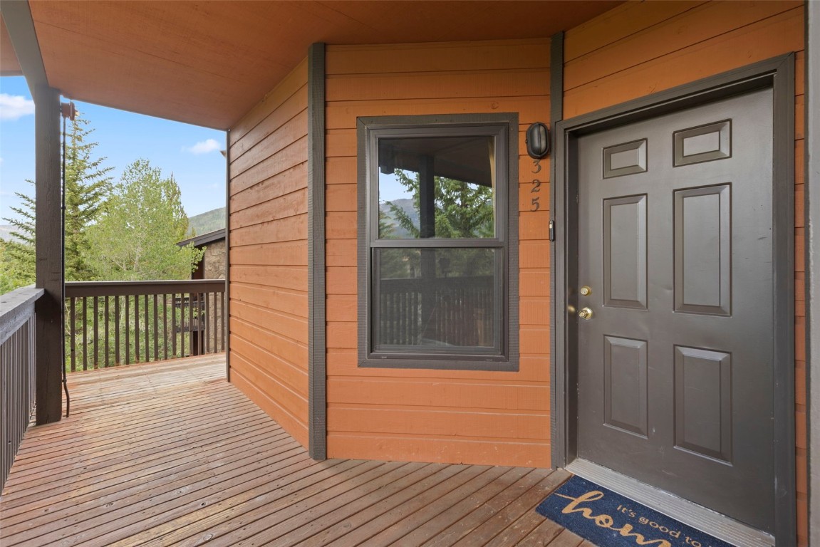 570 Bills Ranch Road, Unit 325 Frisco, CO 80443 - Photo 24 of 30 a view of a porch with a door and wooden floor