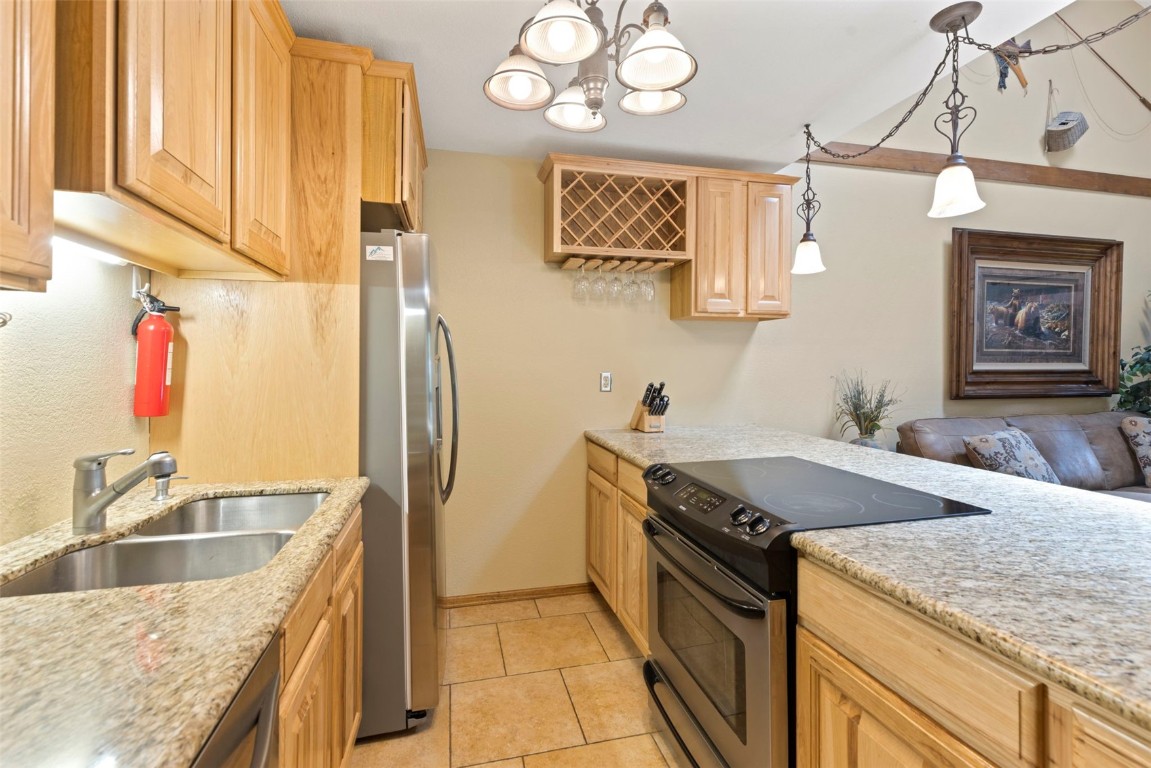 570 Bills Ranch Road, Unit 325 Frisco, CO 80443 - Photo 5 of 30 a kitchen with stainless steel appliances granite countertop a sink stove and refrigerator