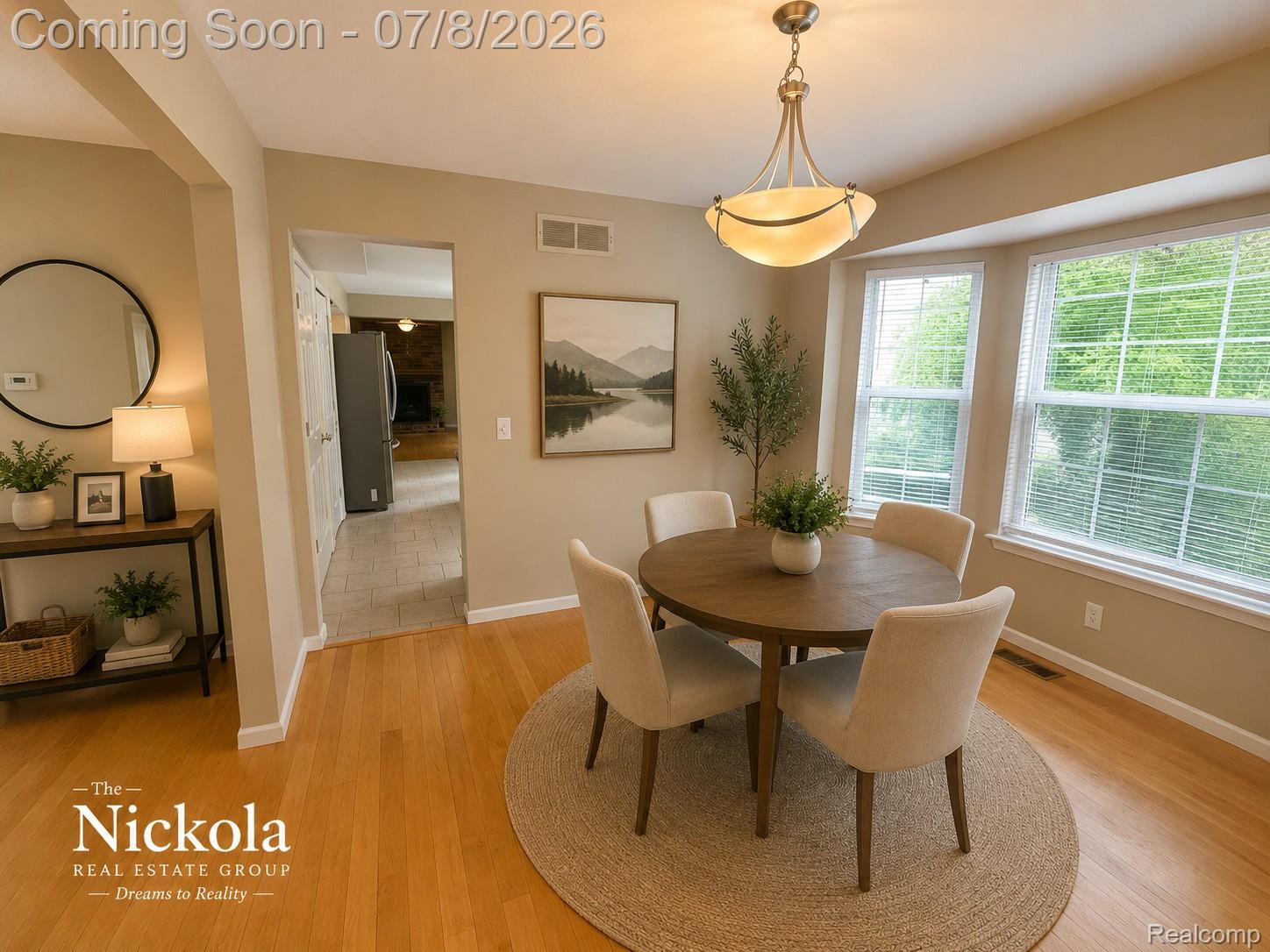 414 Whitney Drive Rochester, MI 48307 - Photo 11 of 30 Dining area featuring hardwood flooring and a bay window with natural light
