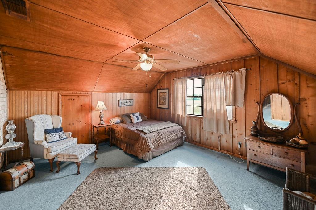 411 Rs County Road 4525 Point, TX 75472 - Photo 17 of 40 a bedroom with a bed mirror and window