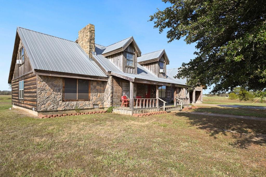 411 Rs County Road 4525 Point, TX 75472 - Photo 30 of 40 a front view of a house with garden