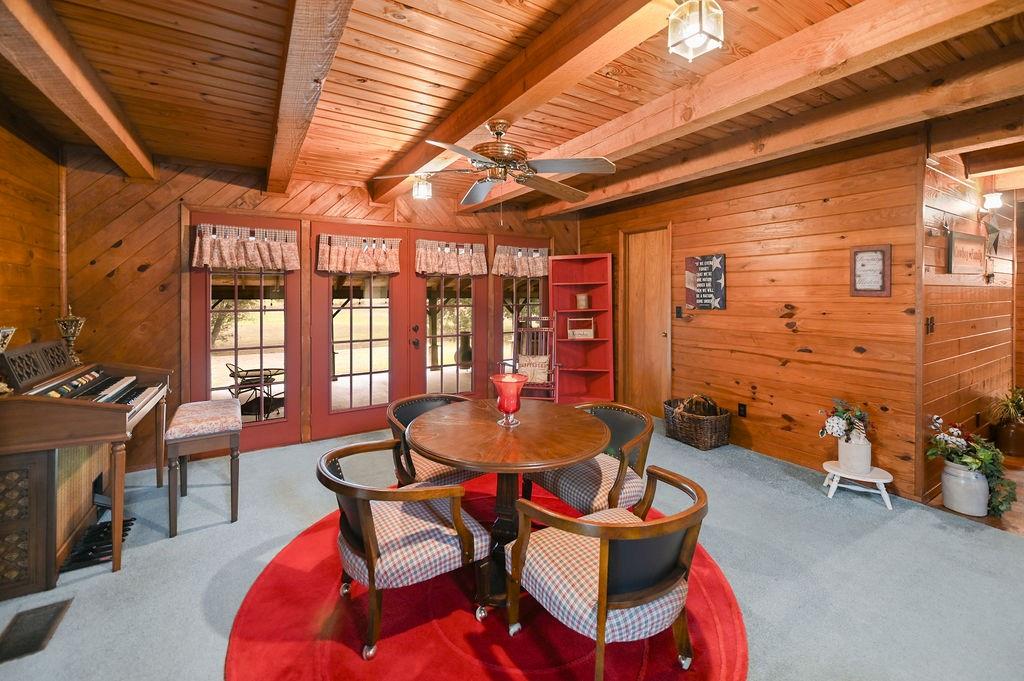 411 Rs County Road 4525 Point, TX 75472 - Photo 9 of 40 a dining room with furniture and wooden floor