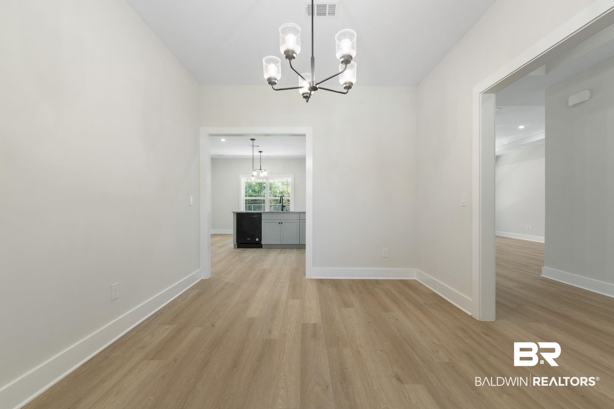 32563 Arbor Ridge Circle Lillian, AL 36549 - Photo 6 of 53 Unfurnished dining area featuring light wood-style flooring and a chandelier