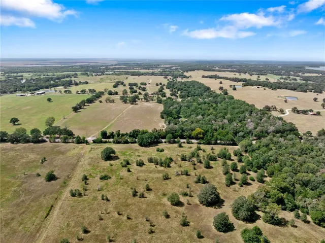an aerial view of a beach with a beach