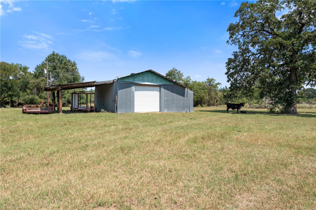 4796 Britten Road Bryan, TX 77807 - Photo 10 of 41 a front view of a house with a yard