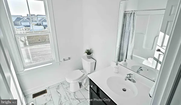 a close view of a refrigerator a sink and a window