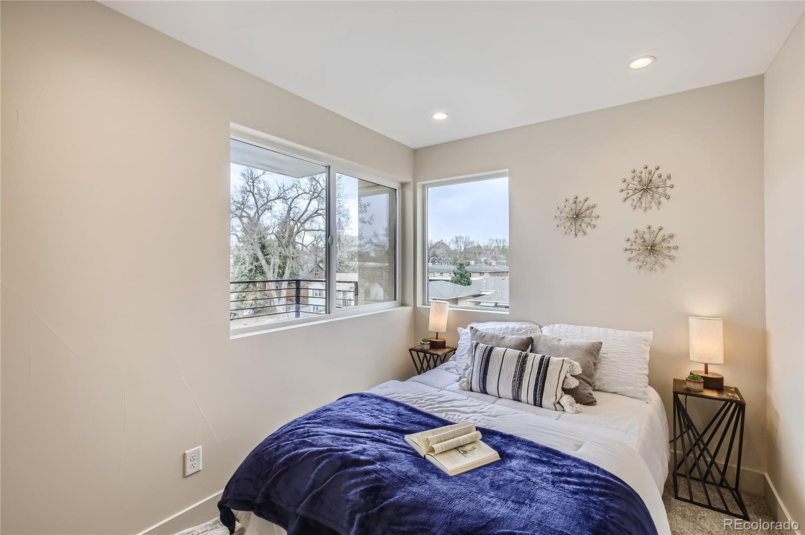 2323 South High Street Denver, CO 80210 - Photo 11 of 21 a bedroom with bed and a window