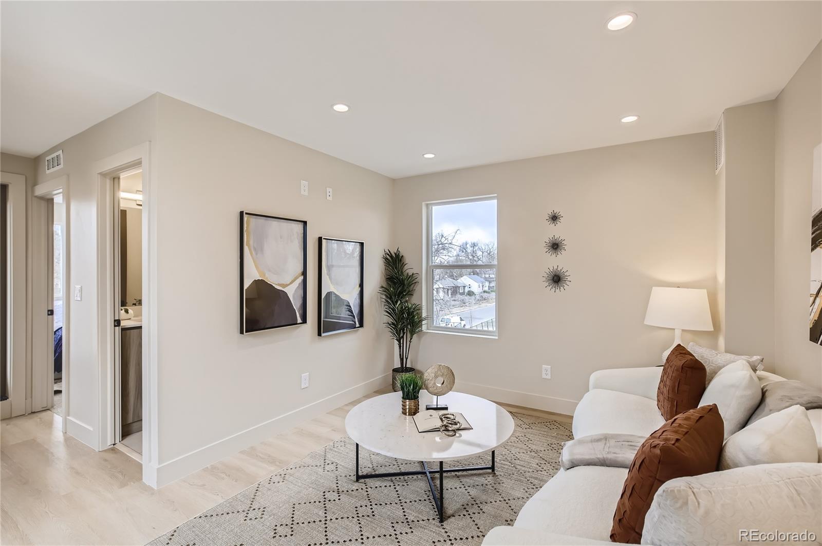 2323 South High Street Denver, CO 80210 - Photo 14 of 21 a living room with furniture and a potted plant