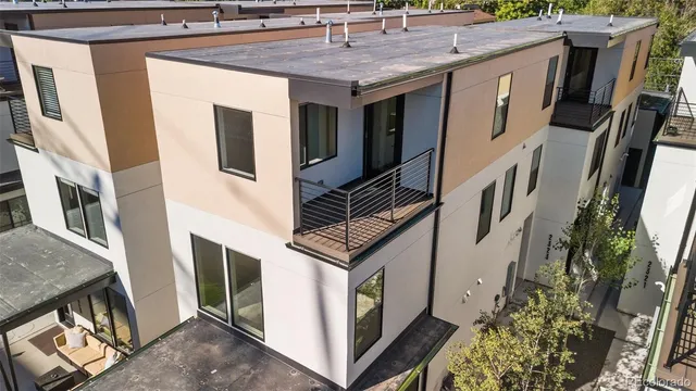 an aerial view of a house with outdoor space